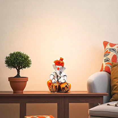 Karigaari India Polyresine Orange & White Ganesha Playing Tabla