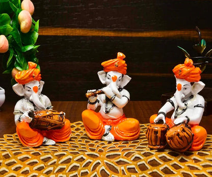 Karigaari India Polyresine Set of 3 Orange Dhoti & Turban Ganesha Playing Instruments Showpiece